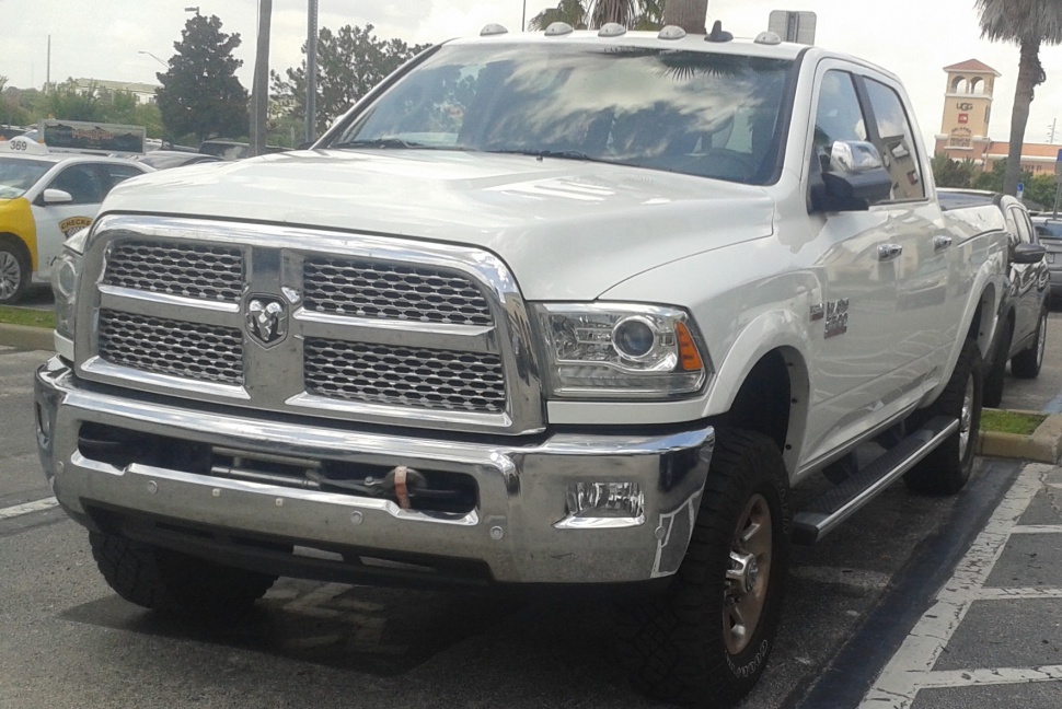 Front chrome grille and headlight detail on heavy-duty pickup truck