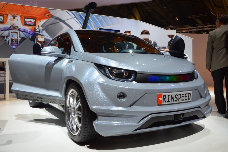 Futuristic front design with LED light strip on compact electric car