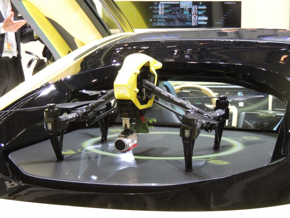 Drone integrated within a concept vehicle display showcasing innovative technology.