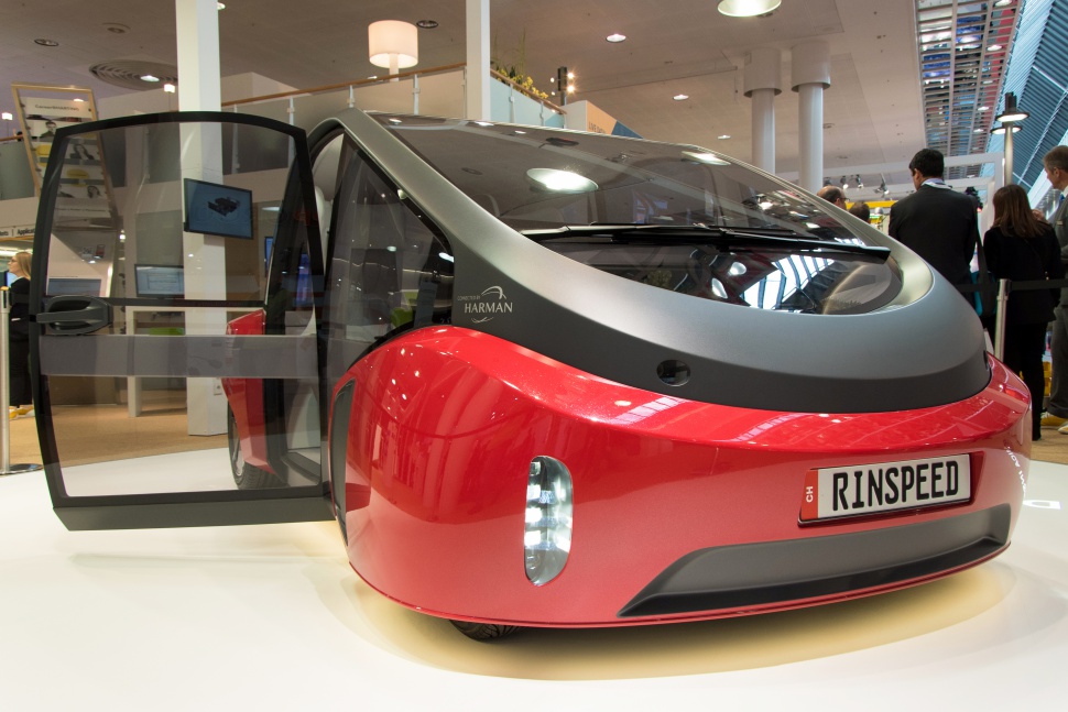 Futuristic vehicle with transparent gull-wing doors and advanced lighting