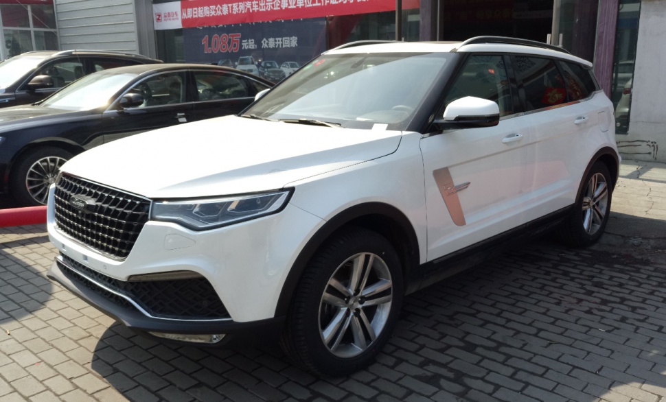 White modern SUV with distinctive front grille and alloy wheels