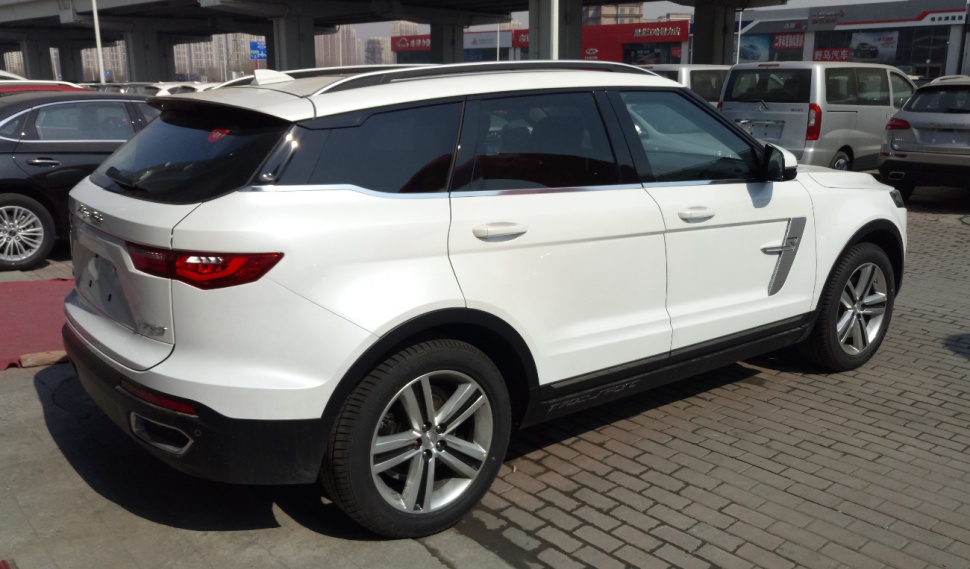 Modern white SUV side and rear design with tinted windows and alloy wheels.