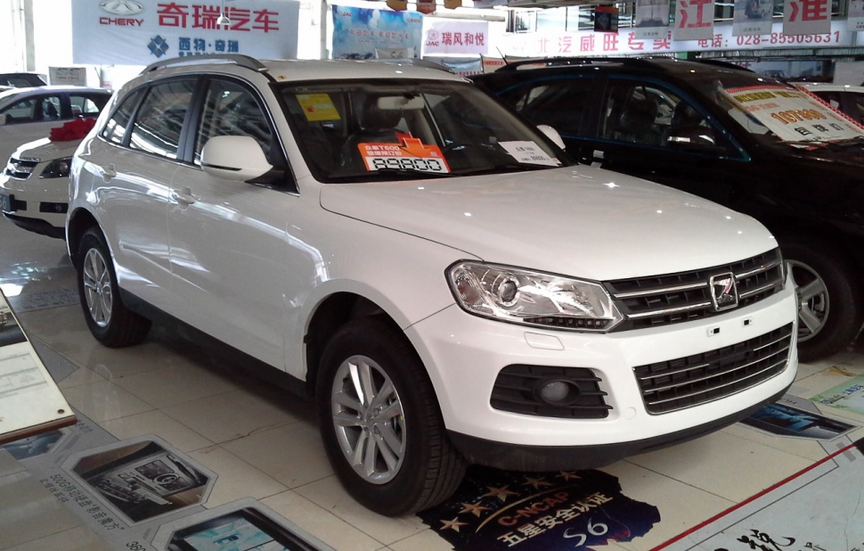 White compact SUV front and side profile in showroom