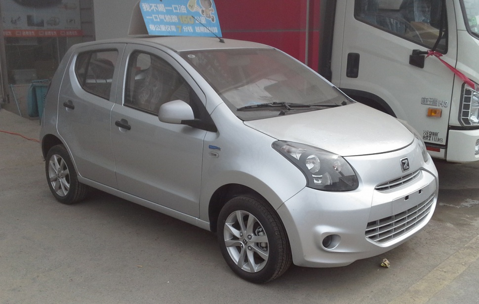 Compact silver hatchback with unique headlights and horizontal grille slats
