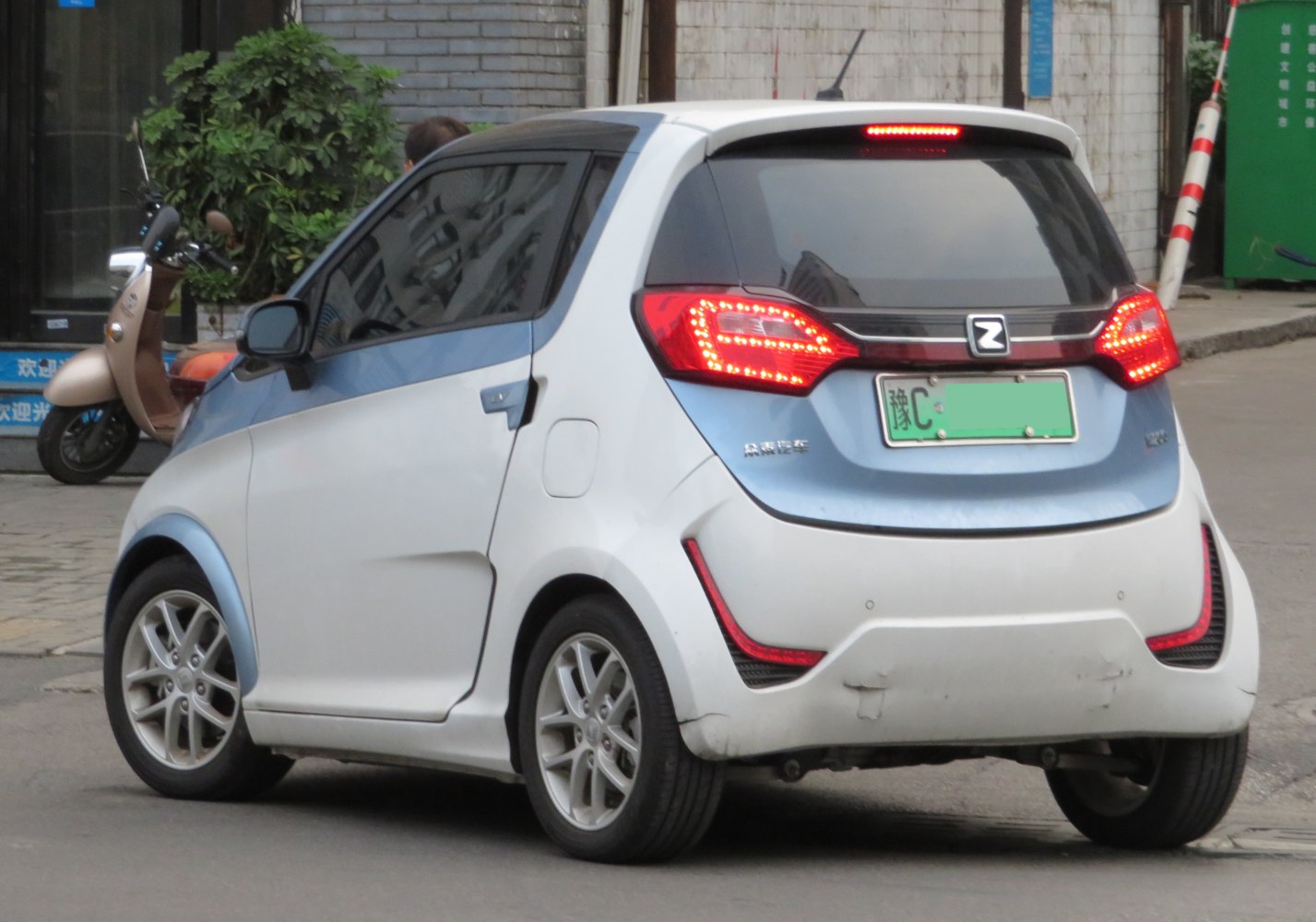Compact electric hatchback rear view with LED taillights and tinted windows