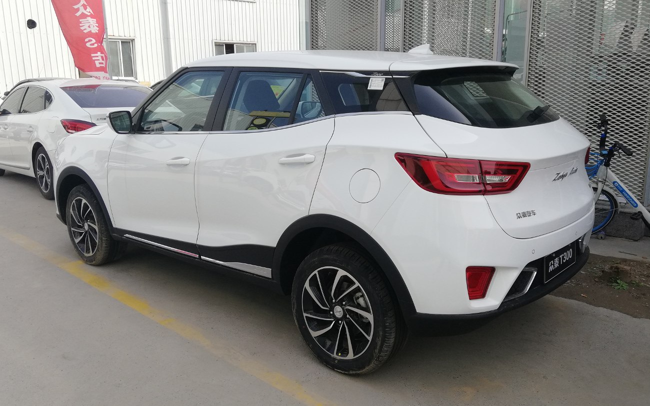 Rear side profile of white SUV with modern tail lights and alloy wheels