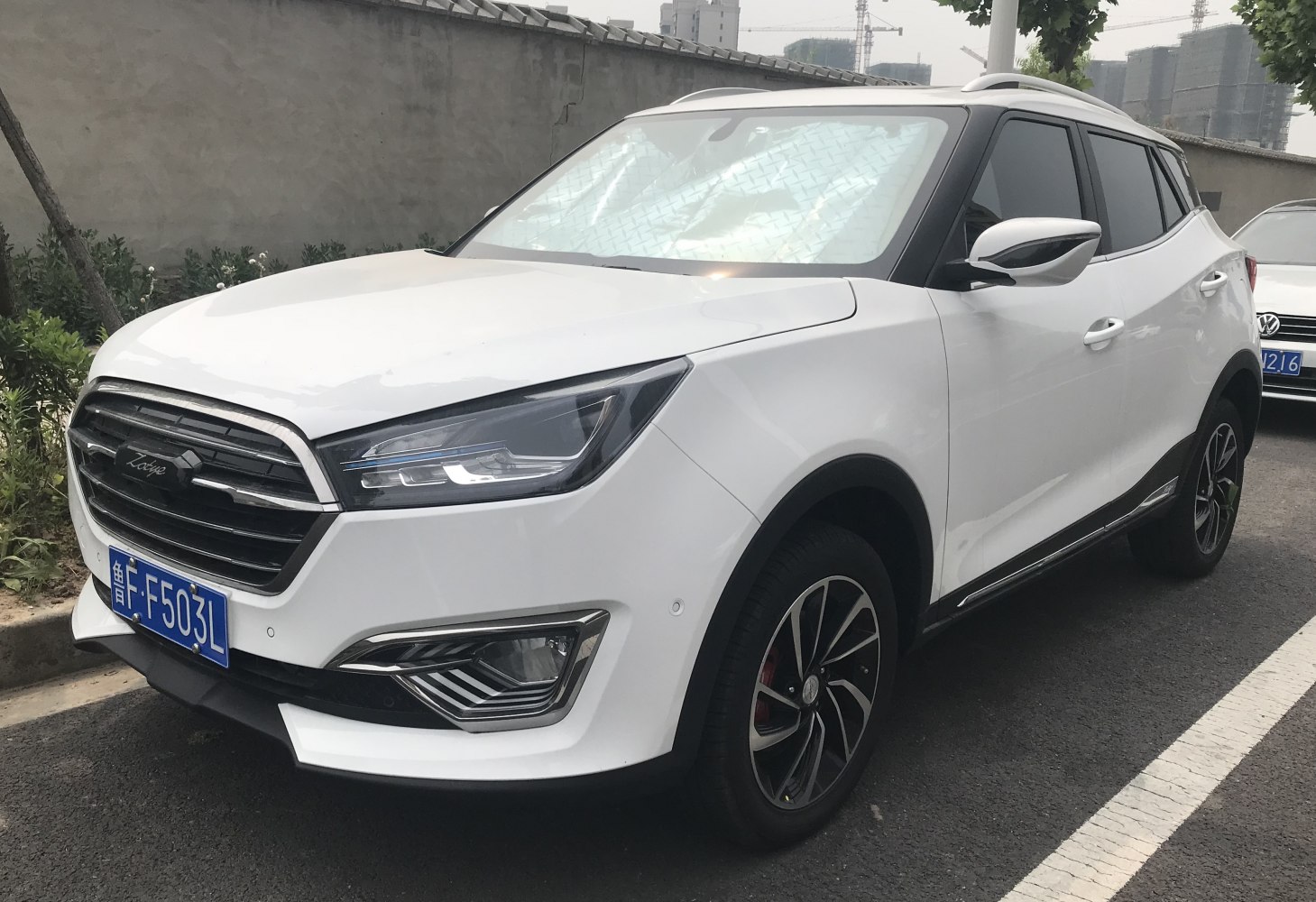 Front view of SUV with modern headlights and alloy wheels
