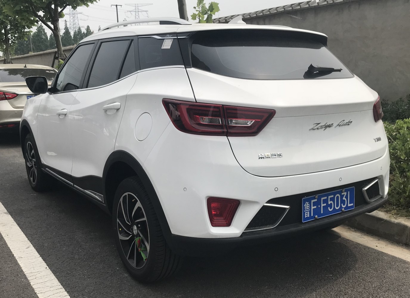Rear side with distinctive taillights and sporty rear bumper.
