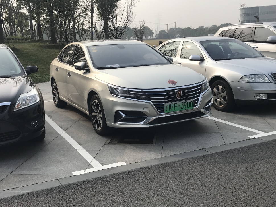 Front view of sedan with LED headlights and chrome grille