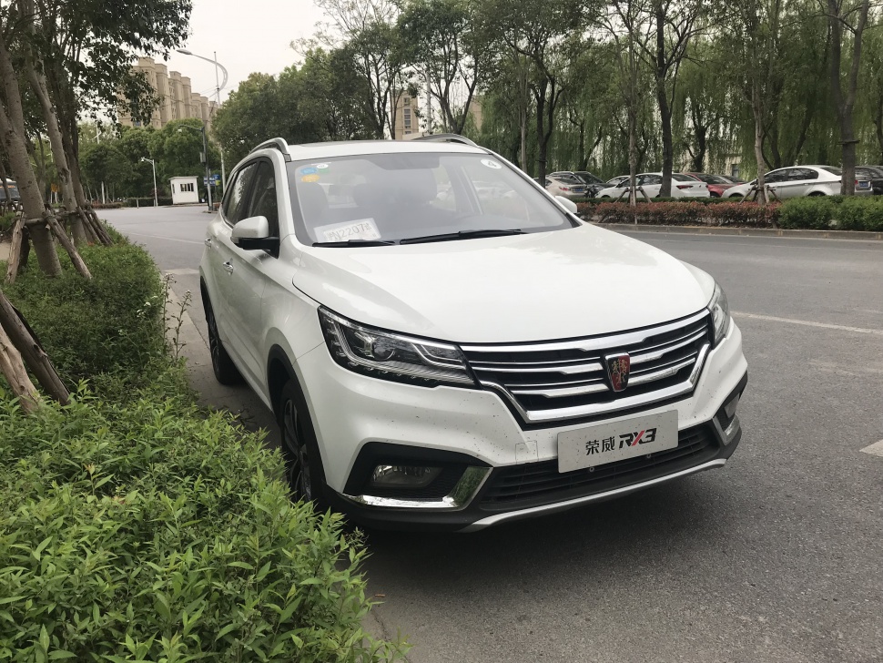 Front view of an SUV with sleek headlights and bold grille