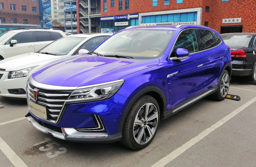 Metallic blue SUV with chrome grille and LED headlights