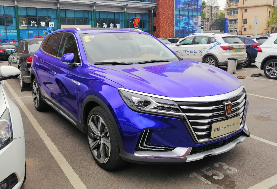 Front view of a modern SUV with LED headlights and sleek chrome grill