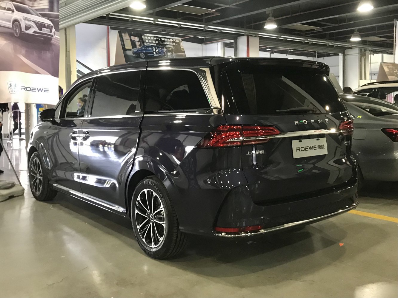 MPV rear view with sliding doors, LED taillights, and alloy wheels