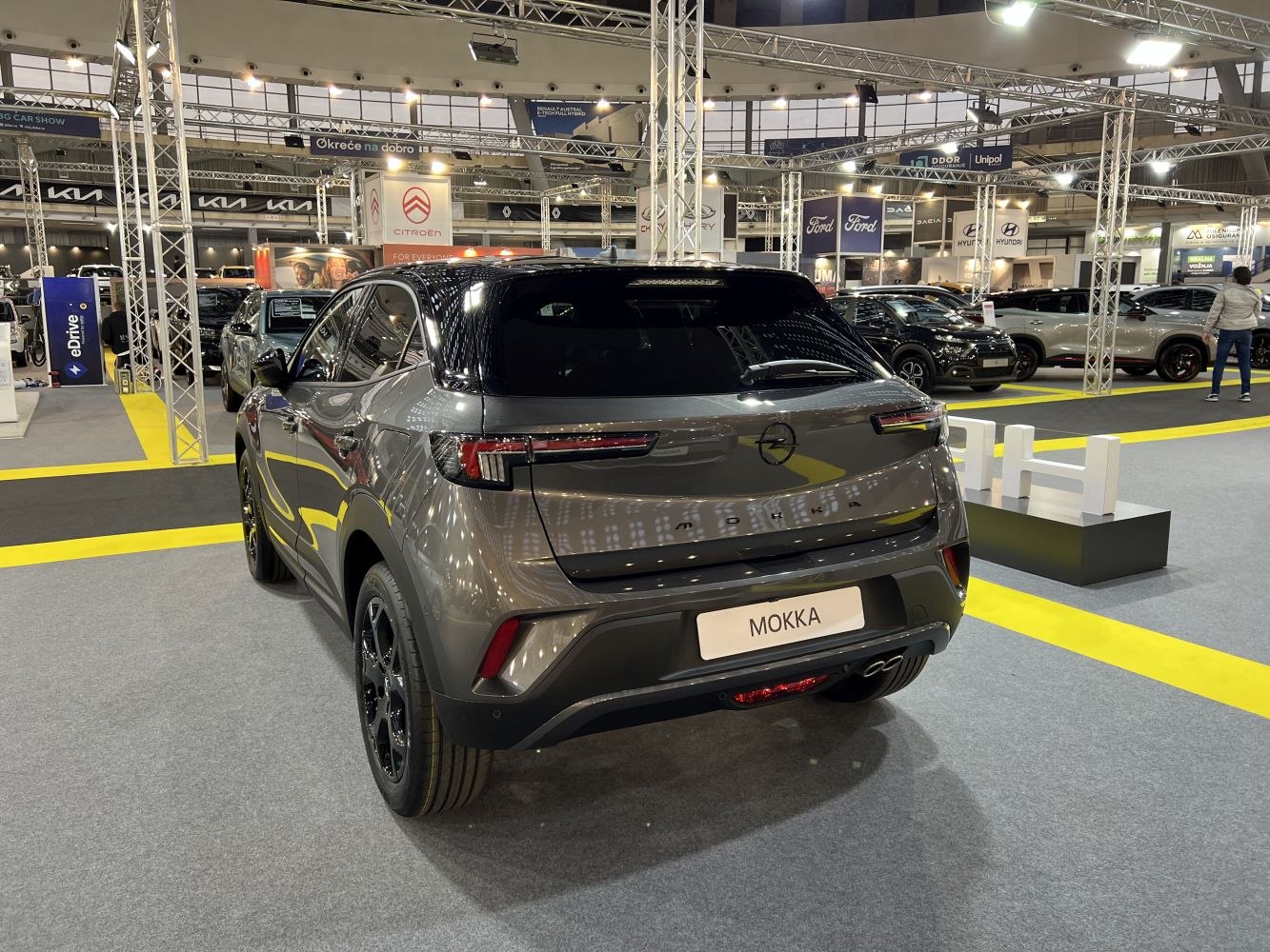 Rear view of a modern compact SUV with sleek tail lights and contrasting roof
