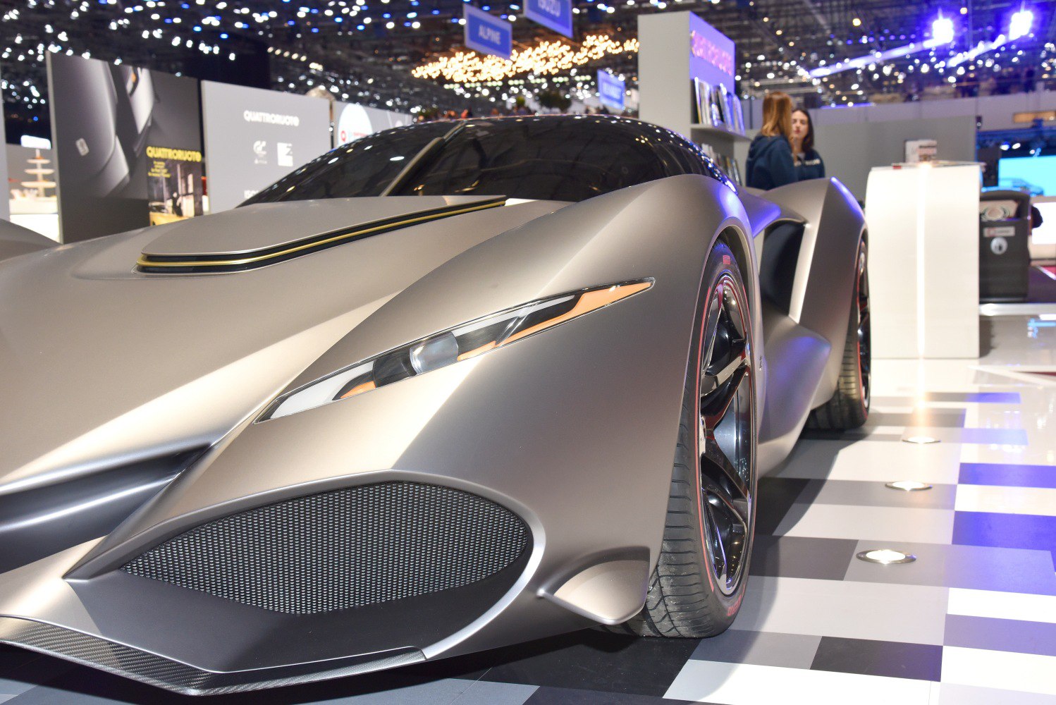 Futuristic front with narrow headlights and large grille vents