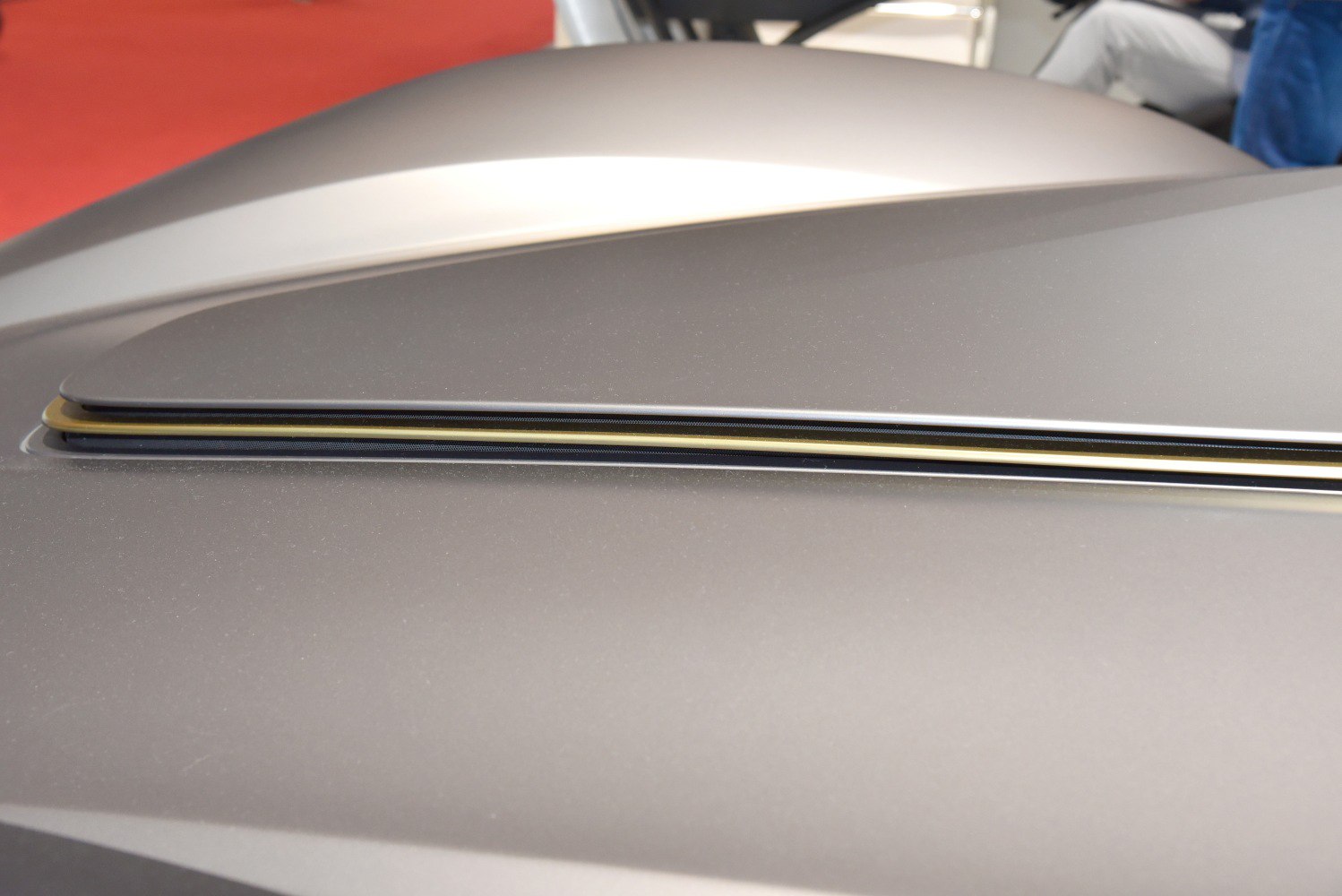 Close-up of a sleek, aerodynamic rear spoiler on a modern sports vehicle.