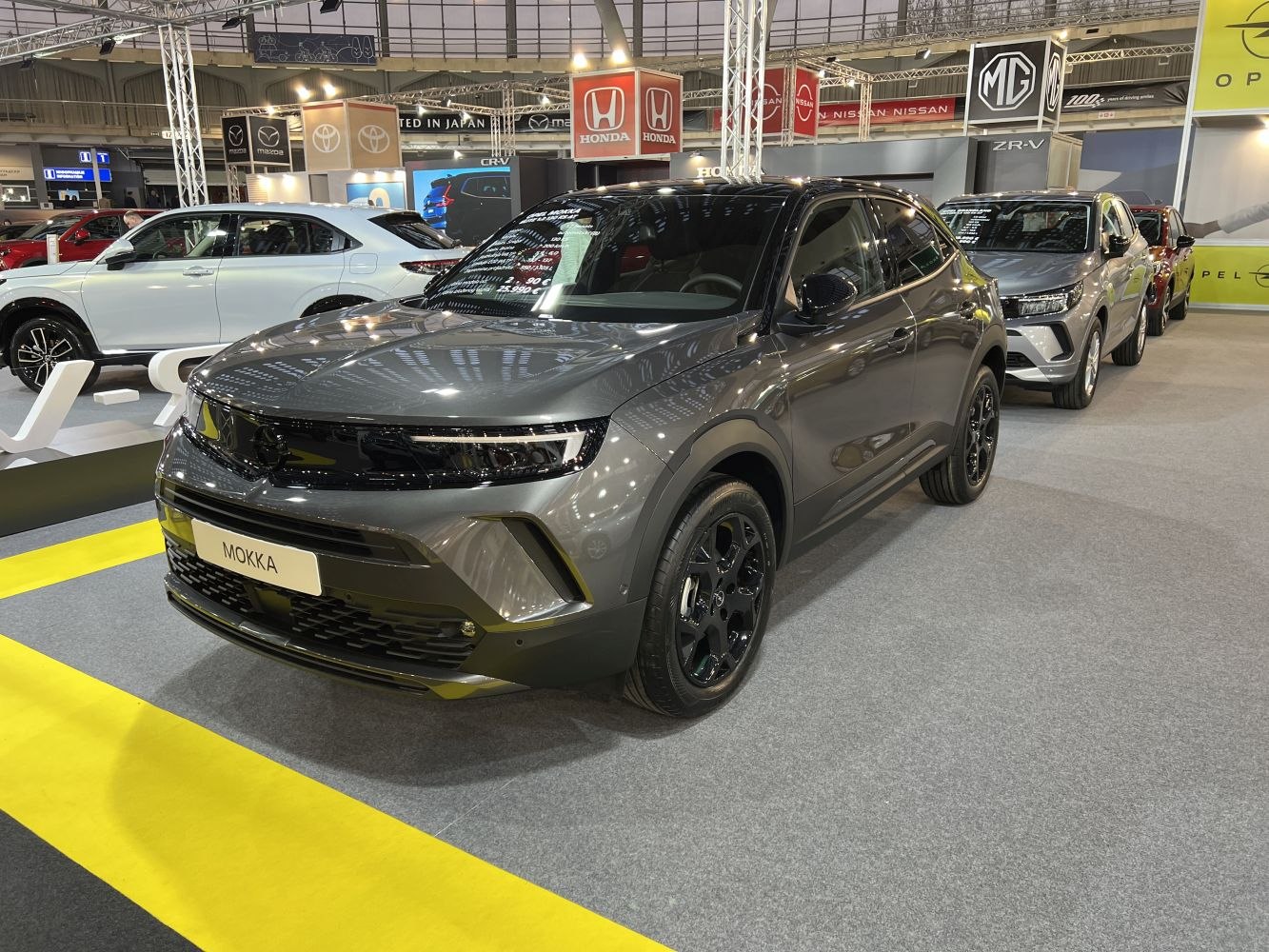 Front fascia and side profile of a modern compact SUV with black wheels
