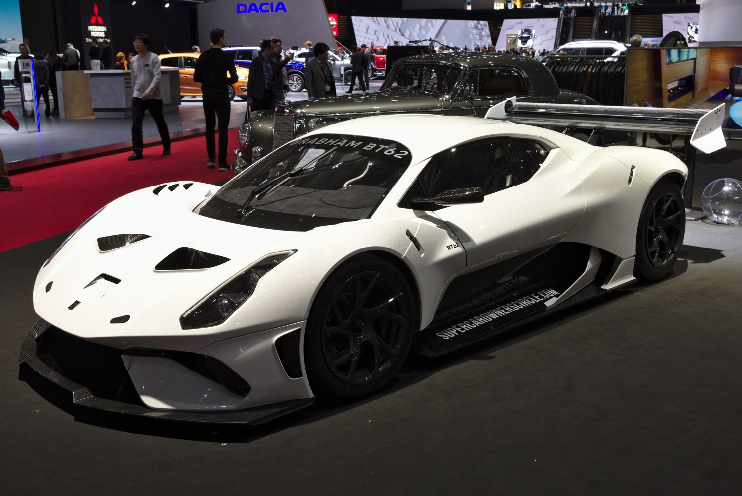 White racing supercar with aerodynamic design and large rear wing