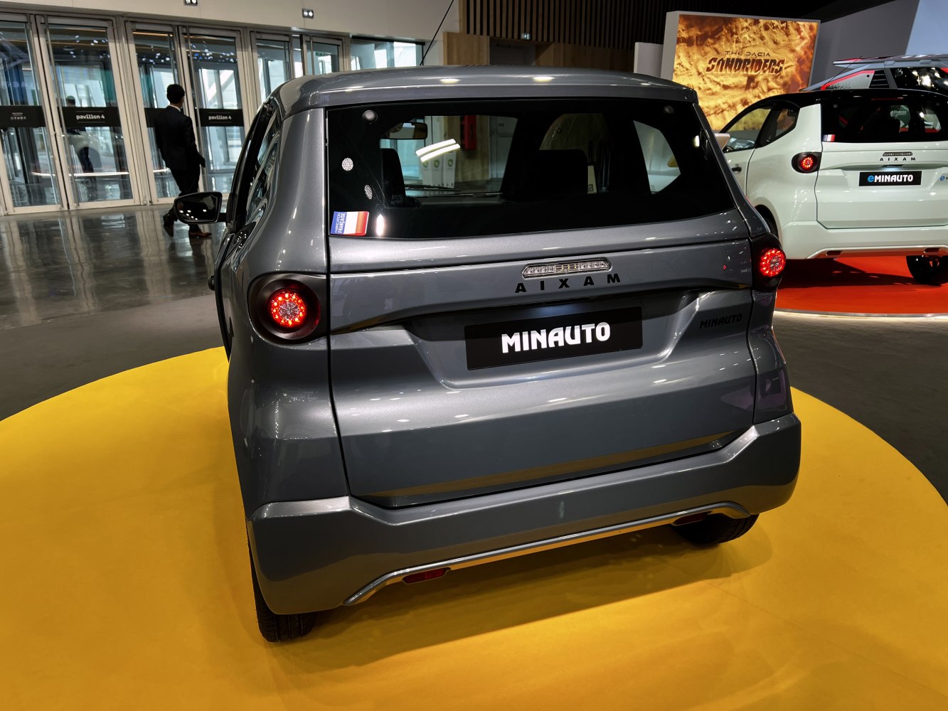 Compact vehicle rear with round tail lights and minimalistic styling