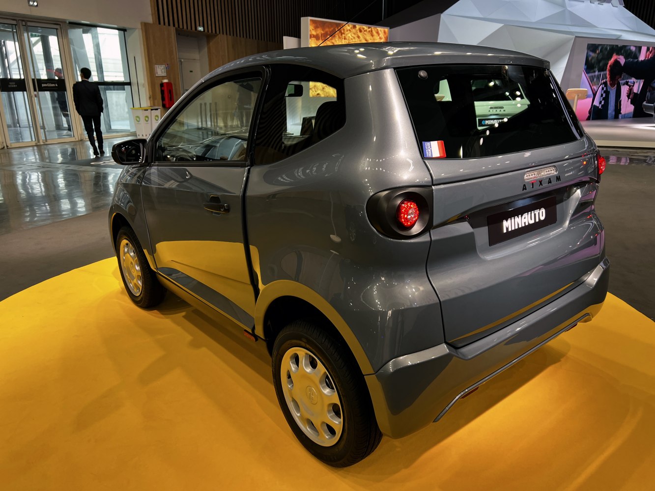 Compact microcar rear with round taillights and modern curves