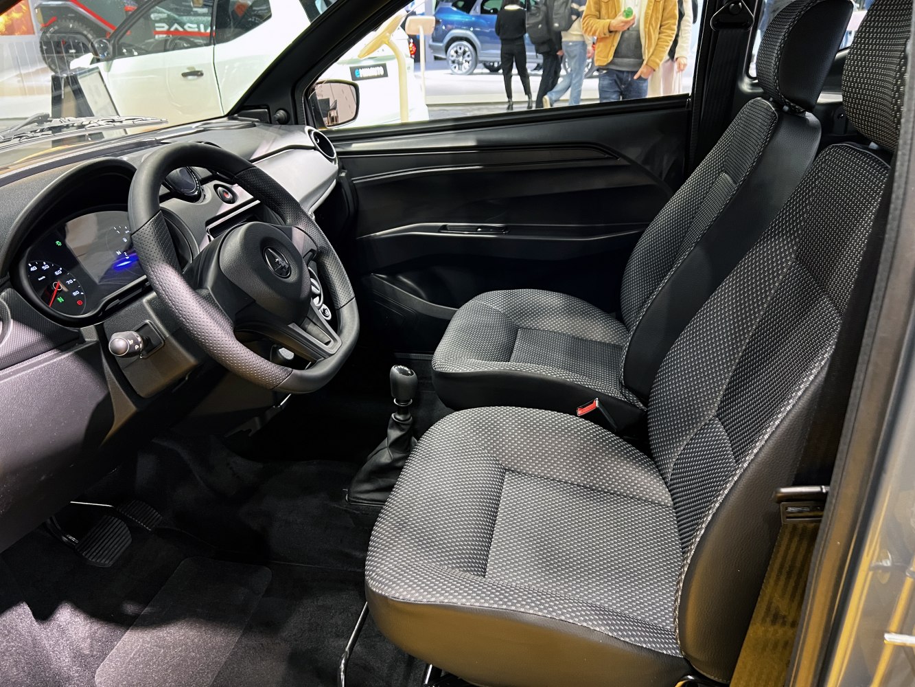 Compact car interior with detailed dashboard and front seats