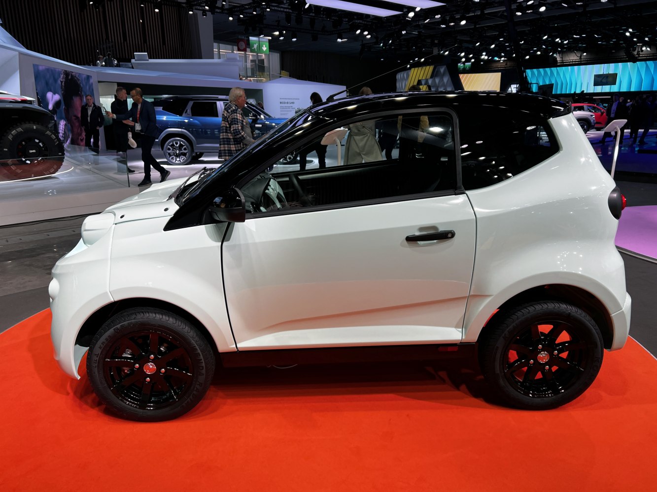 Compact mini urban vehicle with black roof and black alloy wheels
