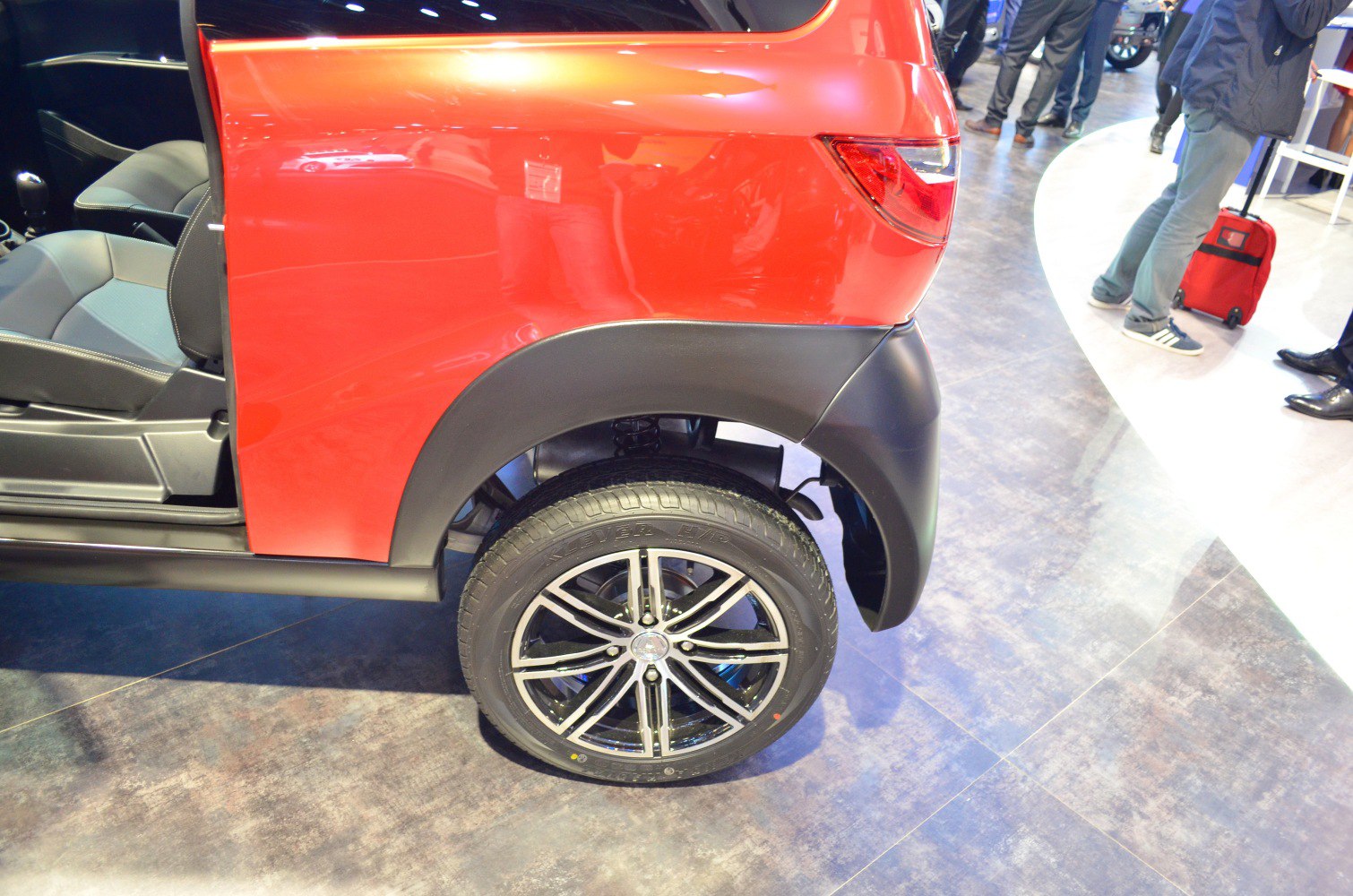 Rear wheel, door, and part of rear body panel with tail light