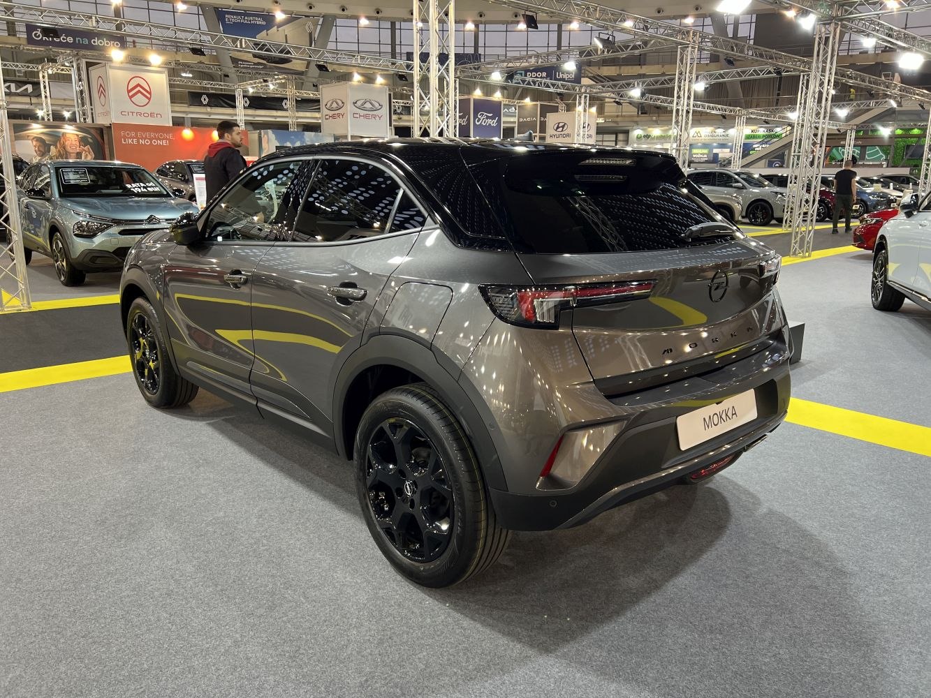 Sleek rear side view with black roof and modern tail lights