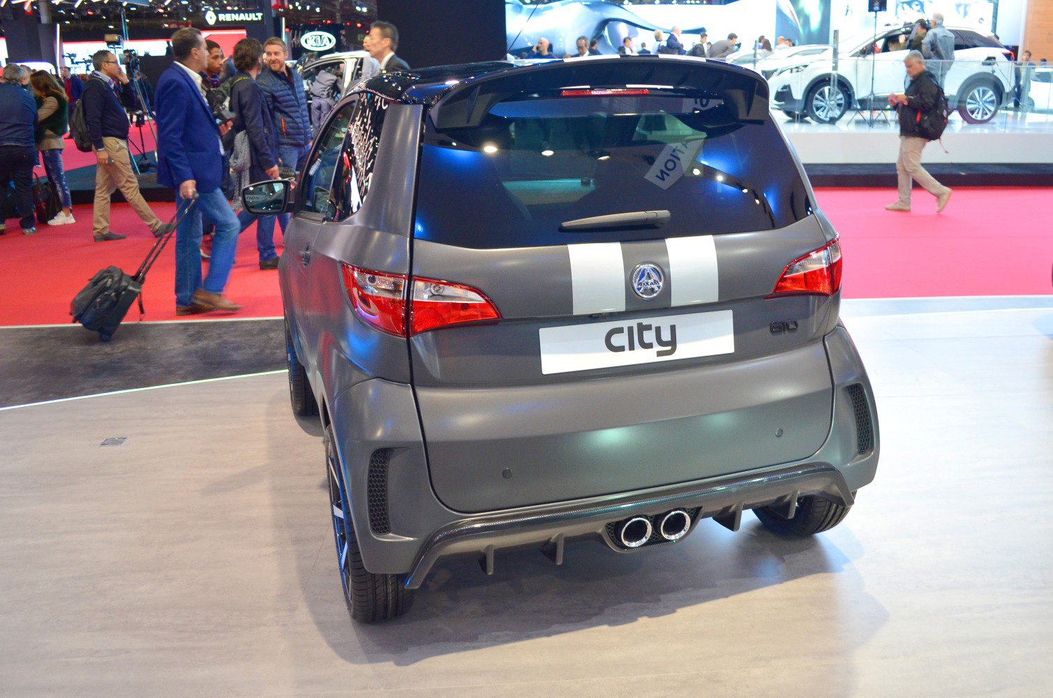 Compact city microcar rear with dual exhaust and modern tail lamps