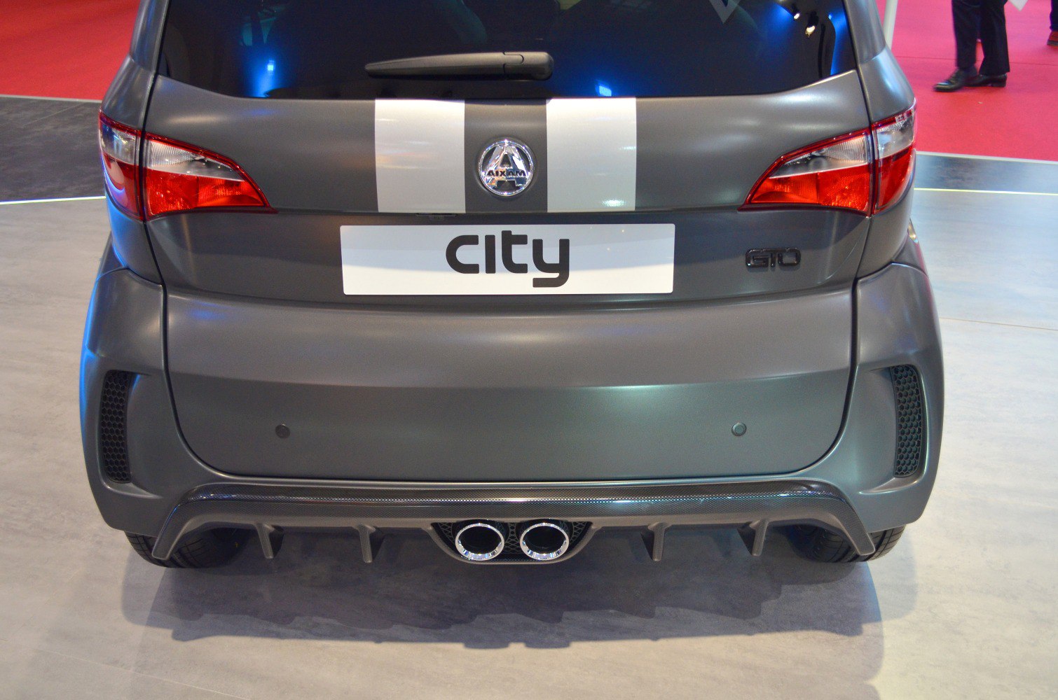 Rear view with dual exhaust pipes and tail lights