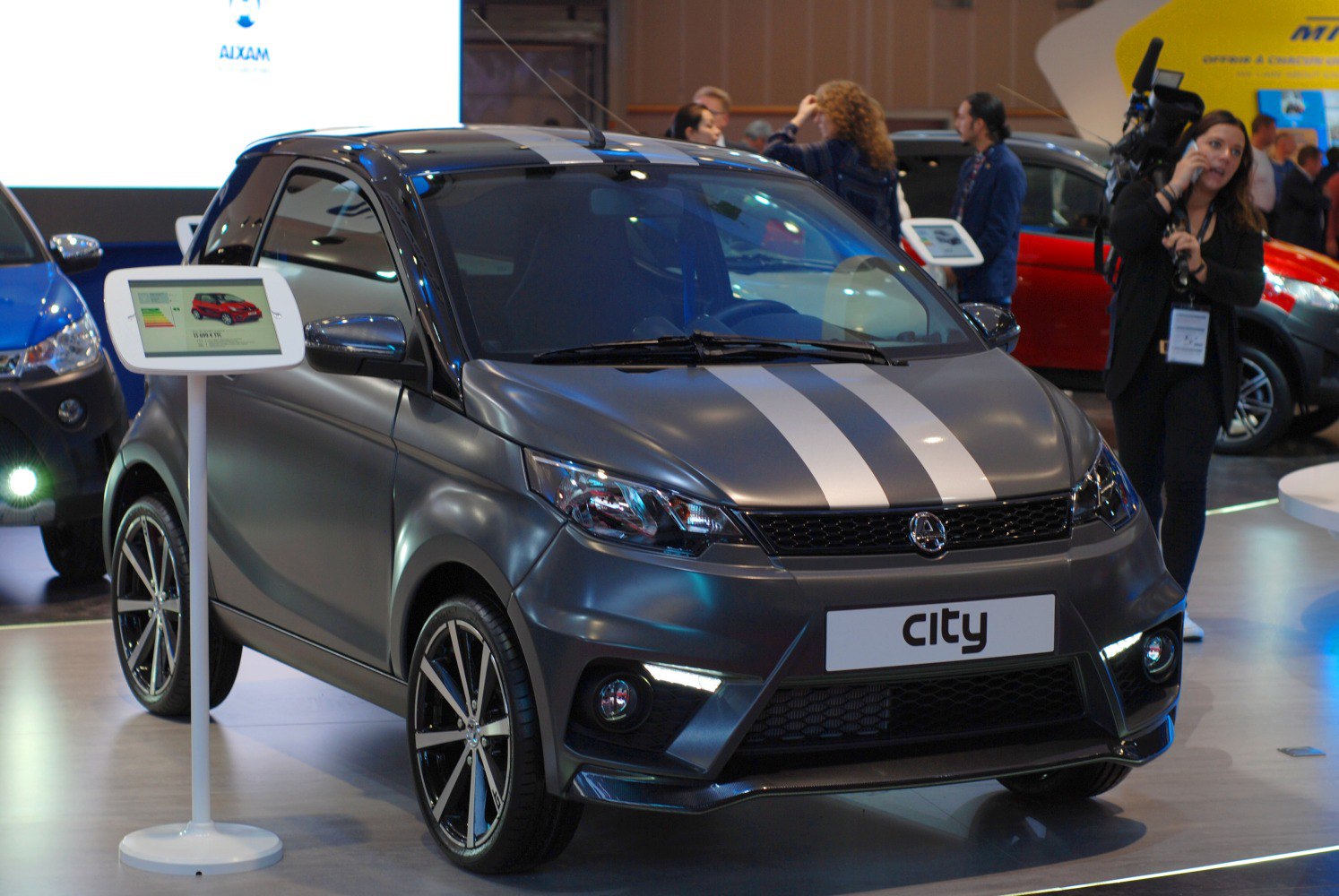 Compact microcar with sporty dual stripes and LED daytime running lights
