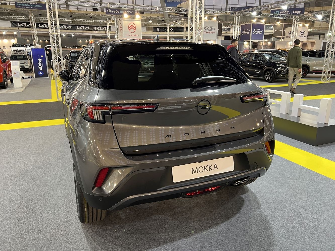 Rear view with sleek LED tail lights and dual exhaust.