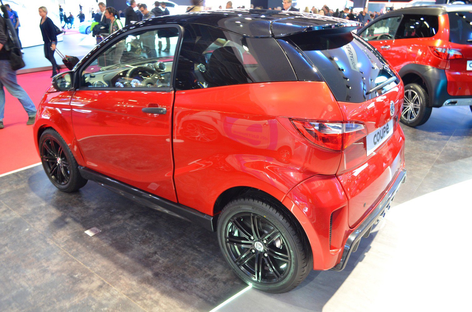 Two-tone mini coupe with black alloy wheels and sporty rear design