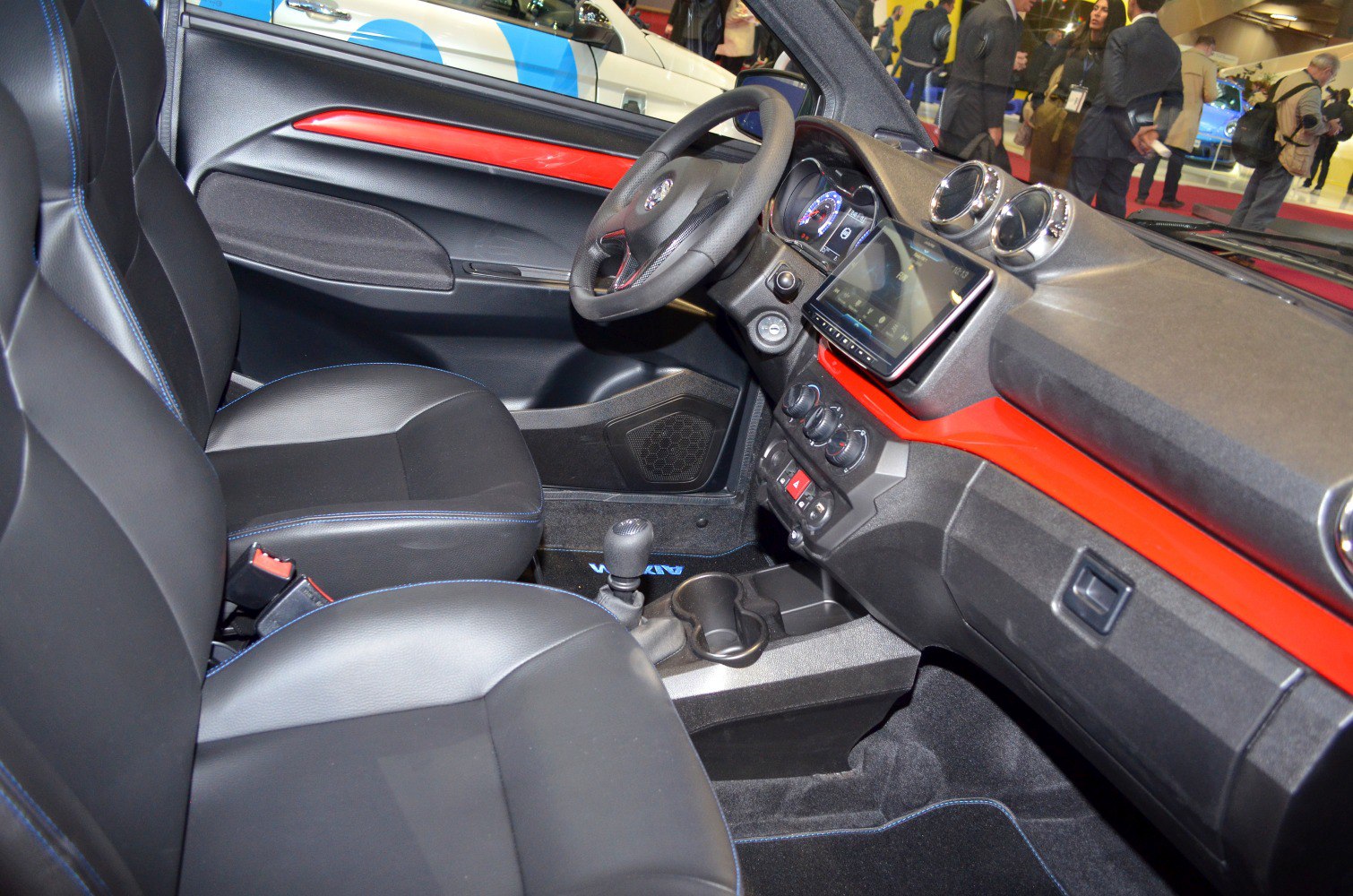 Dashboard, steering wheel, and front seating in a compact car interior