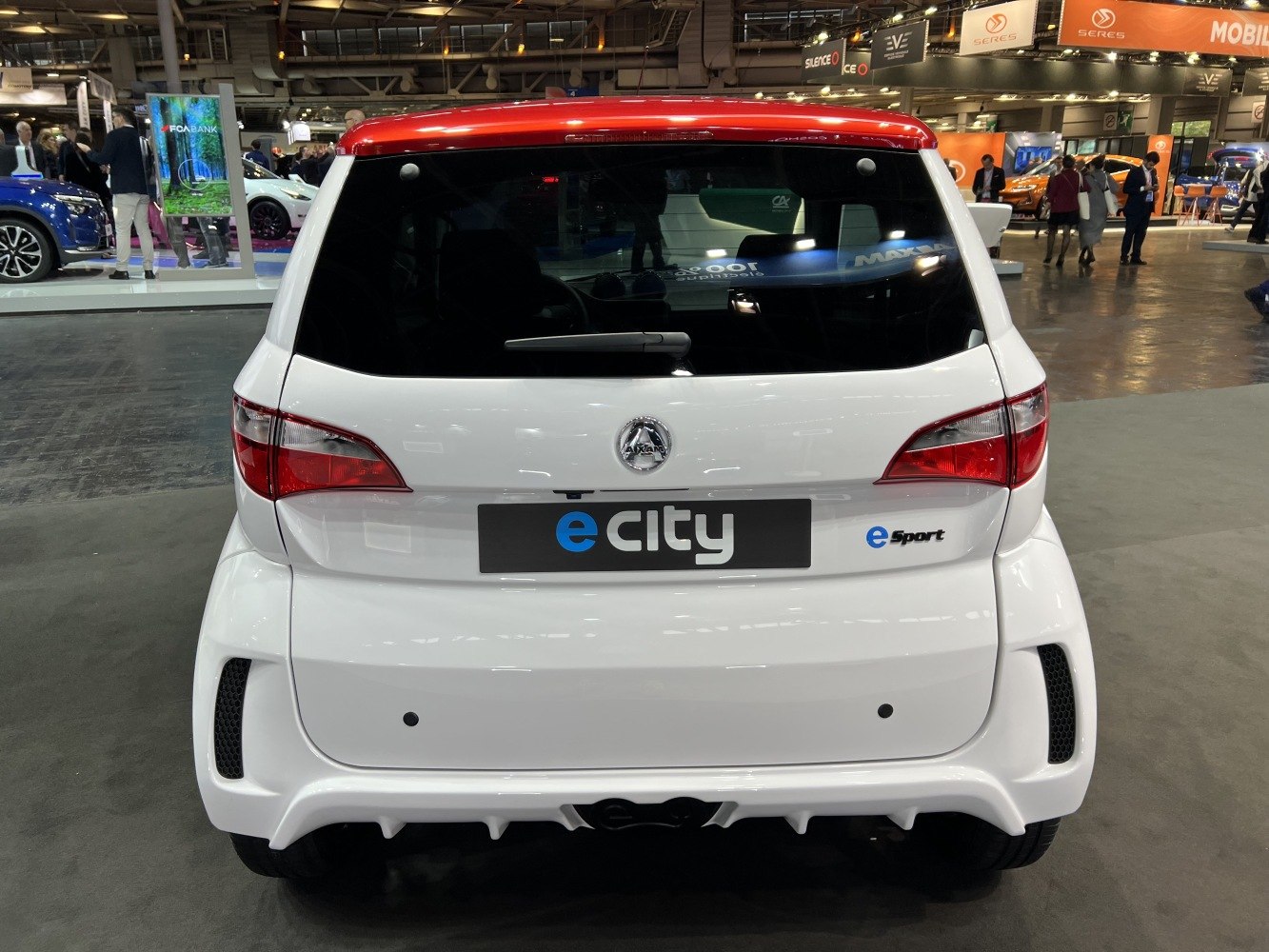 Rear view of a compact electric microcar with sporty design elements