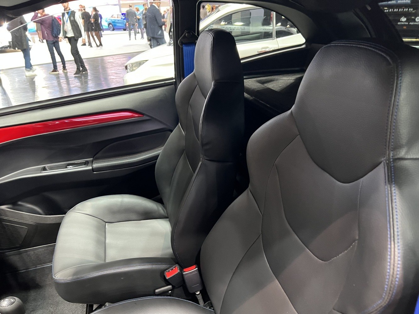 Black leather front seats with red door trim