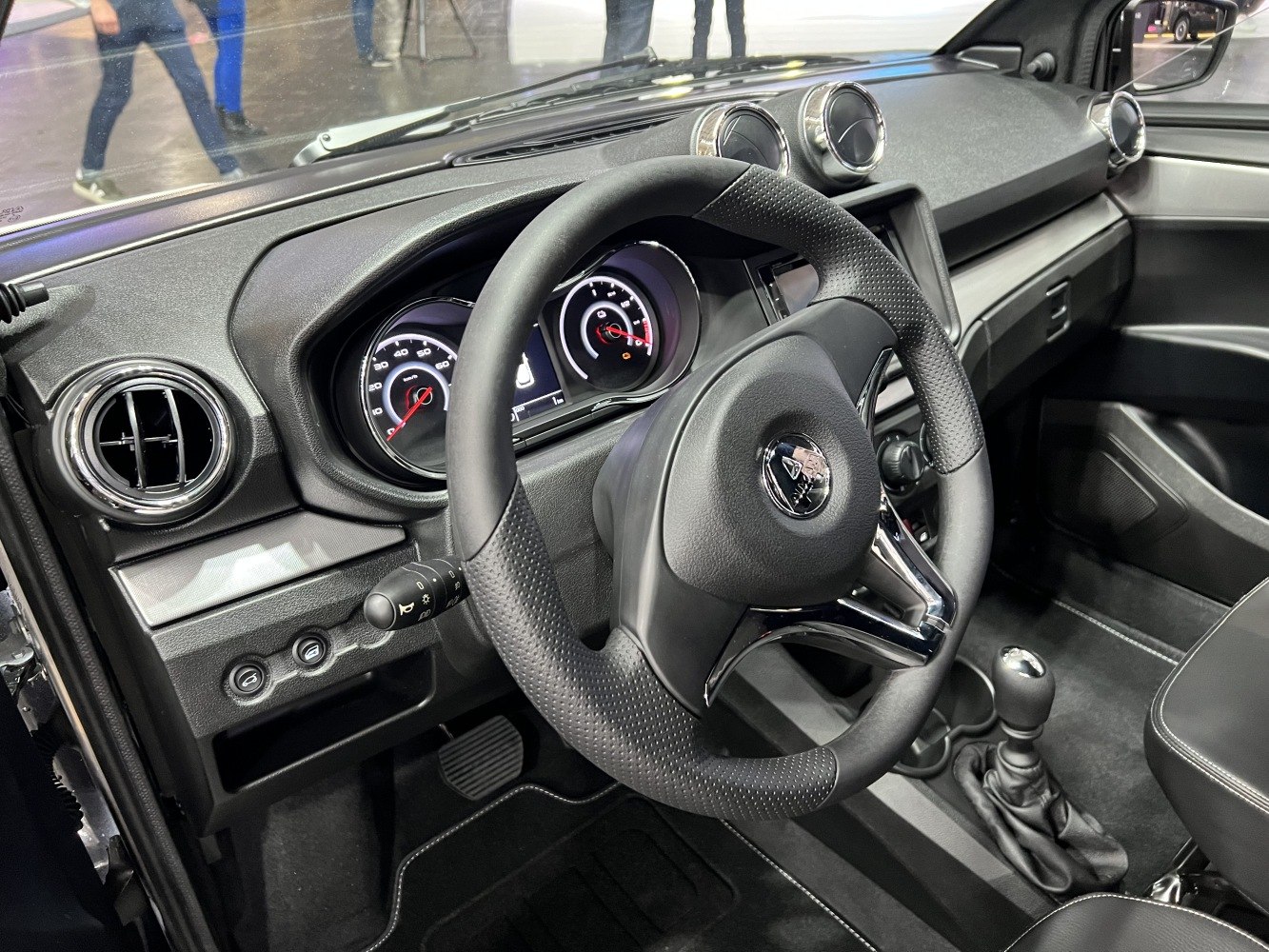 Steering wheel, instrument cluster, and air vents of vehicle interior