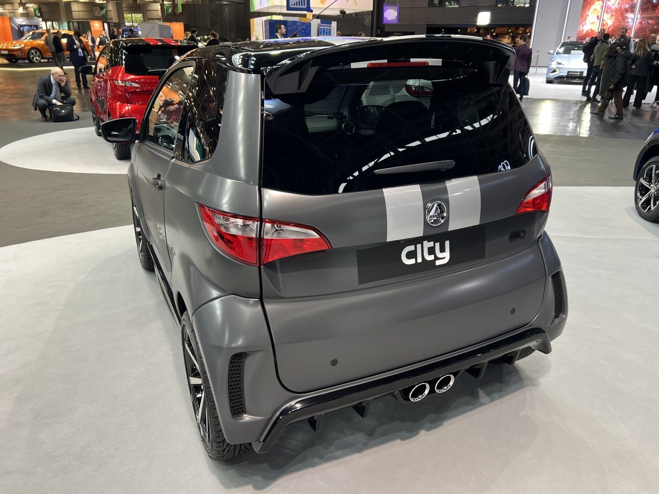 Rear view of sporty compact car with dual exhaust and aerodynamic features