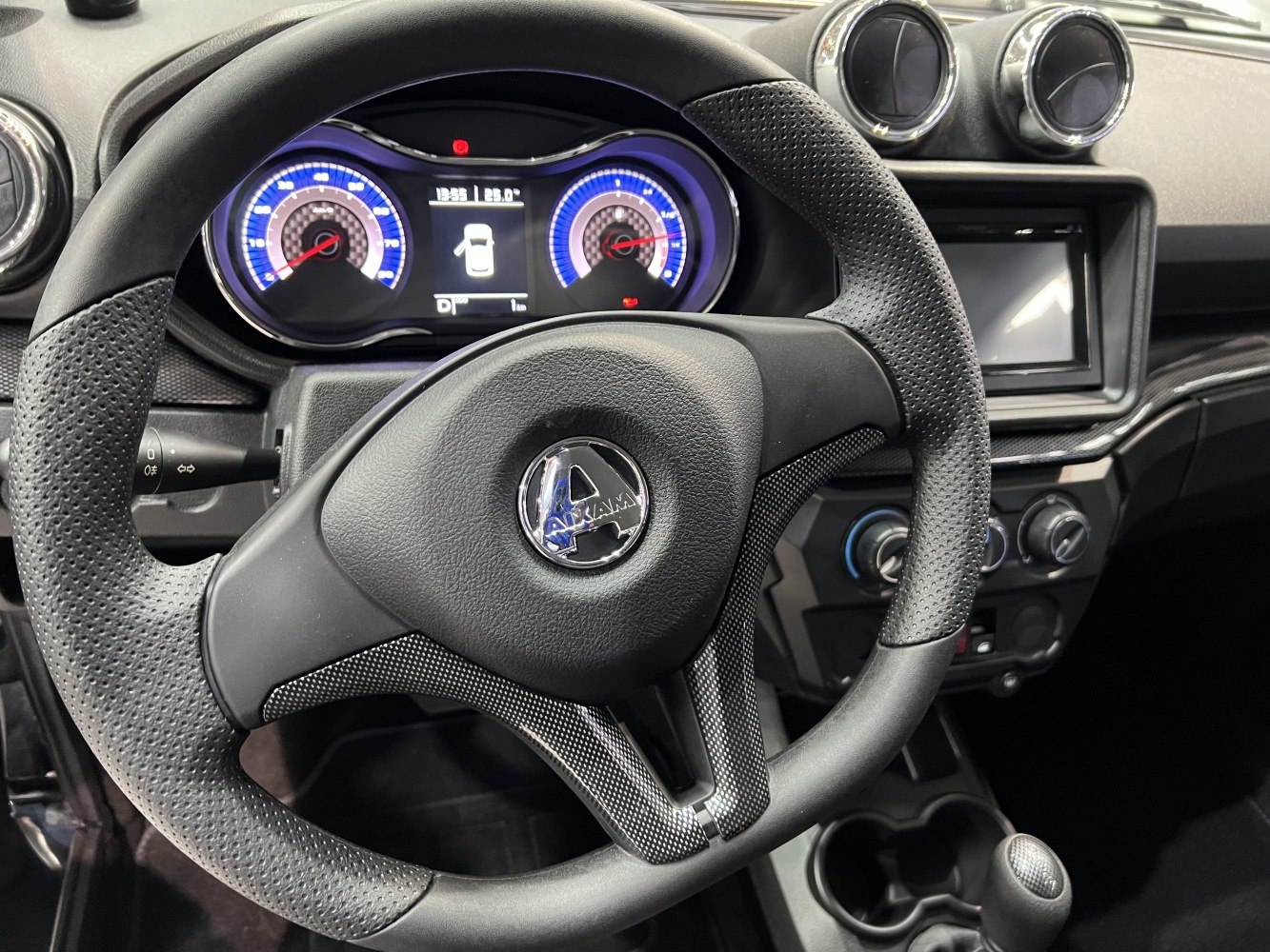 Sporty steering wheel with perforated grips and illuminated instrument gauges