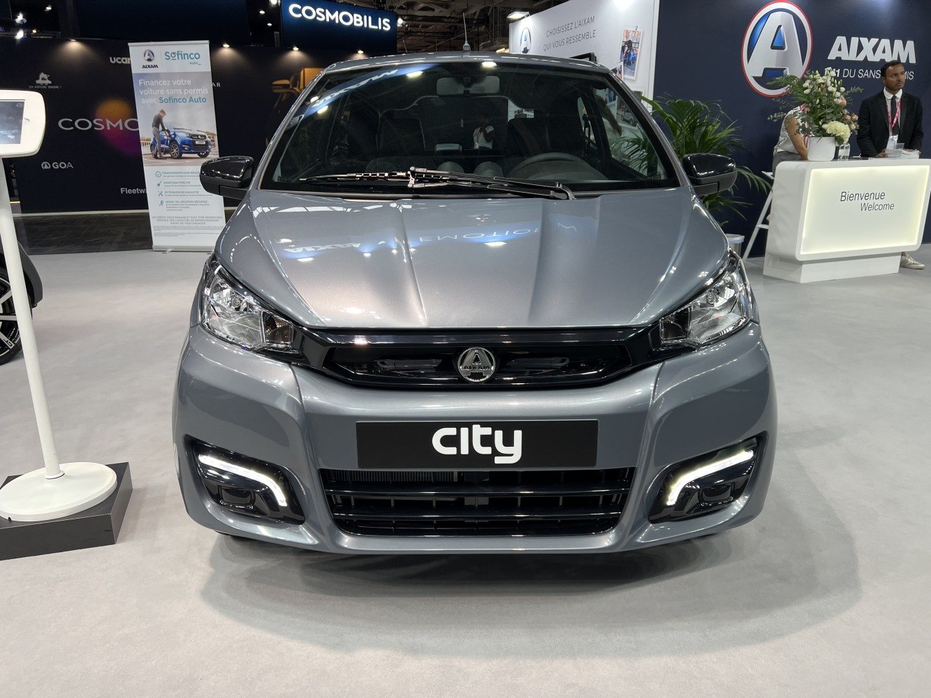 Front view of compact urban vehicle with modern headlights