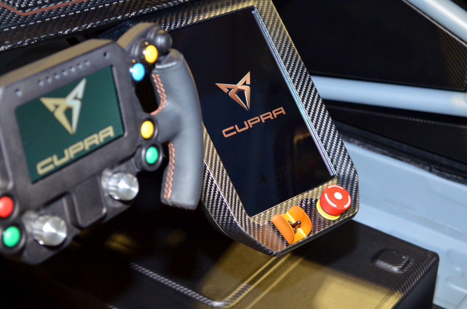Digital steering wheel and carbon-fiber control panel with buttons and emergency stop