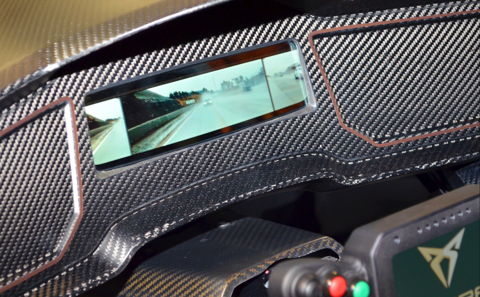 Carbon fiber dashboard with integrated digital rearview mirror in high-tech cockpit