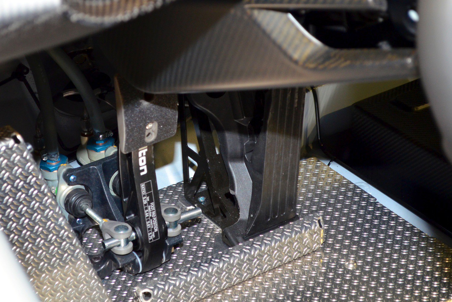 Close-up of pedal assembly and textured floor plate