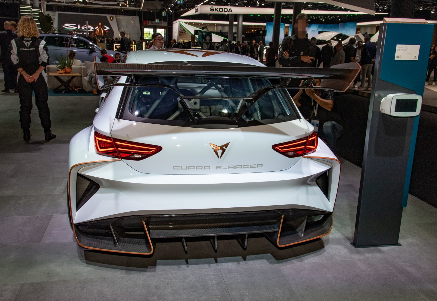 Rear view with large spoiler, LED tail lights, and aggressive diffuser