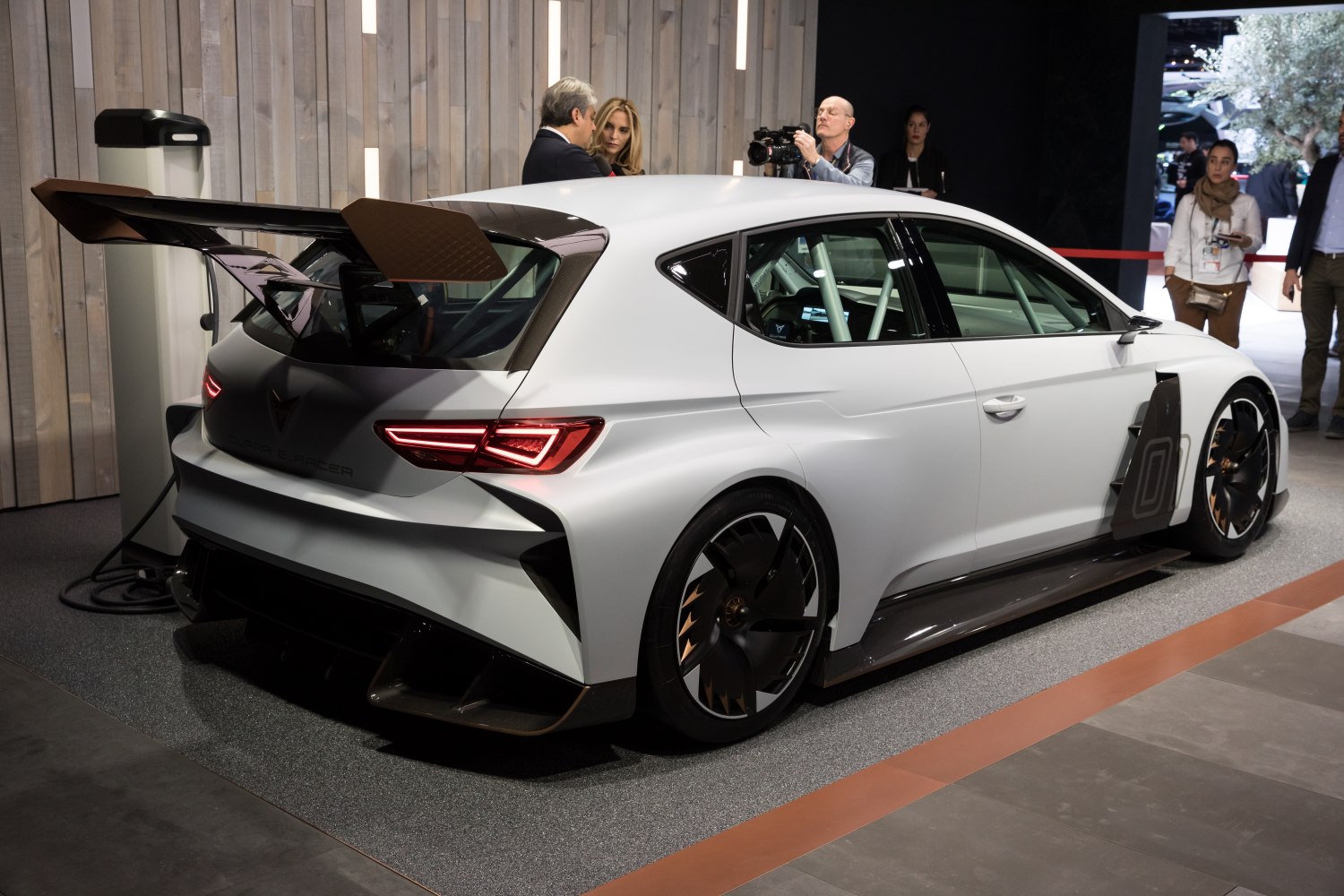 Racing hatchback with large carbon fiber rear wing and aerodynamic wheels