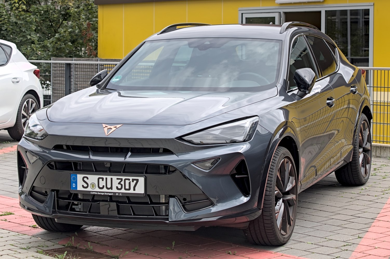 Sleek front fascia with sharp LED headlights and sporty alloy wheels
