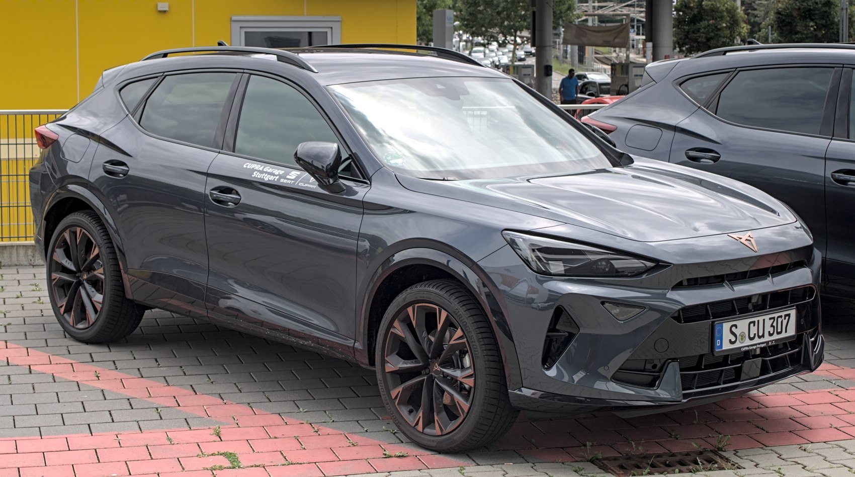 Modern LED headlights and large alloy wheels with bronze accents.