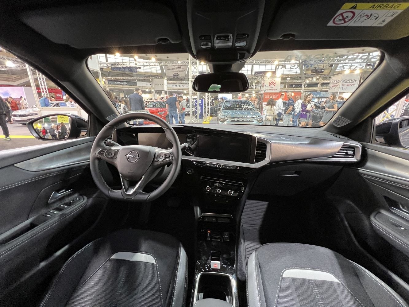 Modern car interior with digital dashboard and multifunction steering wheel