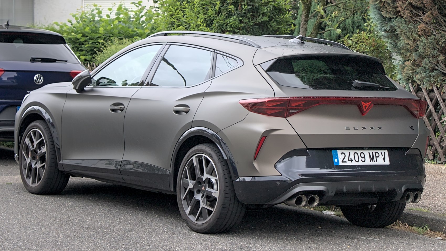 Rear view of crossover with quad exhaust and sleek tail lights