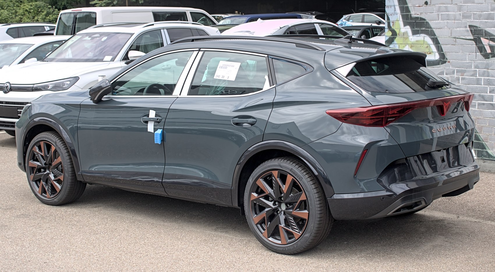 Sleek rear and side view with distinctive alloy wheels and modern tail lights